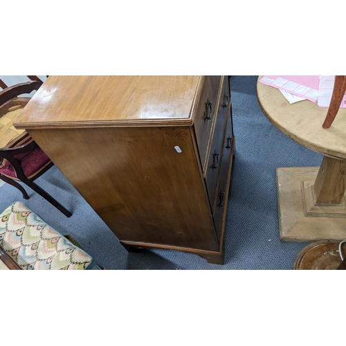 301 - An early 20th century walnut three drawer chest having brass drop handles and on bracket feet, 91.5c... 