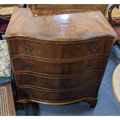 302 - A reproduction mahogany serpentine fronted chest of four long drawers, 84cm h x 75.5cm w
Location: A... 