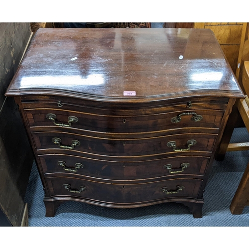 303 - A reproduction mahognay George III style serpentine fronted chest of four drawers ha brush slide and... 