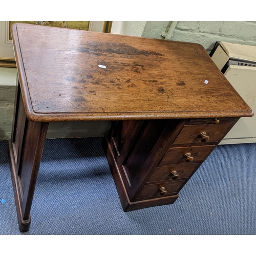 312 - A Victorian desk, one pedestal inset with four drawers and a brush slide, 68cm h x 81cm w
Location: ... 