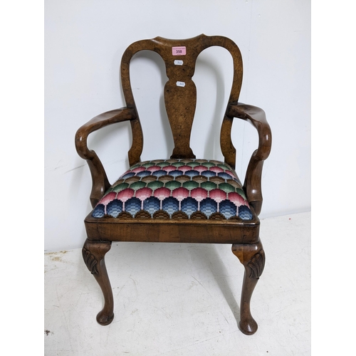 358 - An early 20th century walnut child's armchair upholstered drop-in seat on shell knee carved cabriole... 