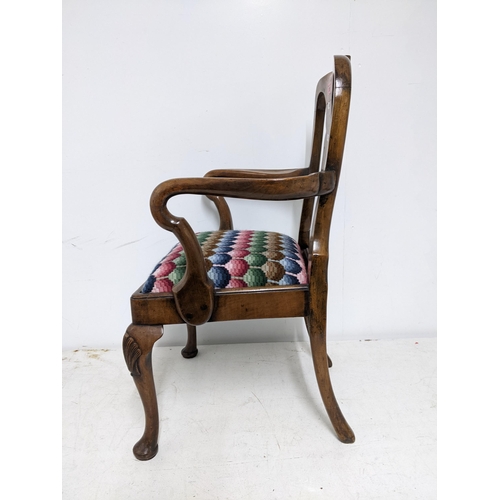 358 - An early 20th century walnut child's armchair upholstered drop-in seat on shell knee carved cabriole... 