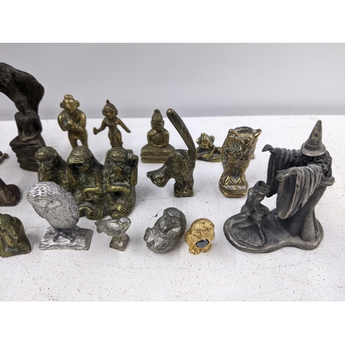 449 - A collection of metal figures and animals including a Chinese bronze figure of an elder, Tibetan Bud... 