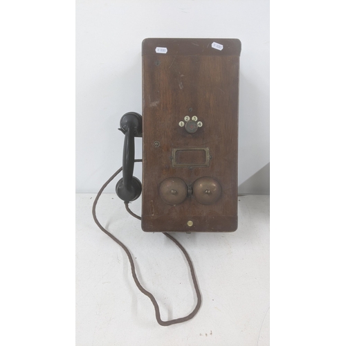 466 - An early 20th century cased wall hanging telephone
Location:A4F
If there is no condition report show... 