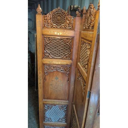 469 - An Indian teak brass inlaid hand carved four fold screen
Location: RC
If there is no condition repor... 