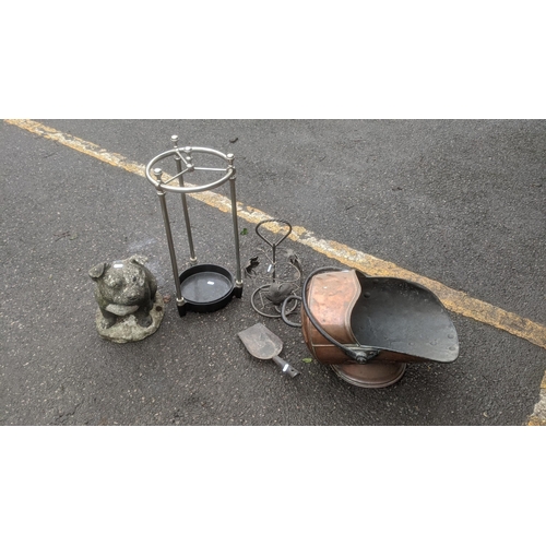 471 - A mixed lot to include a Victorian copper coal scuttle, un umbrella stand, a concrete model of a dog... 