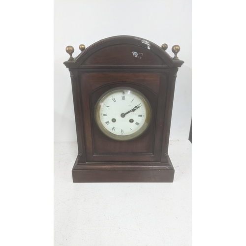 481 - A late 19th century mahogany 8-day mantel clock with floral pierced decoration
Location: 5.1
If ther... 