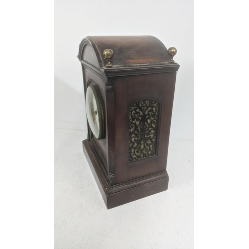 481 - A late 19th century mahogany 8-day mantel clock with floral pierced decoration
Location: 5.1
If ther... 