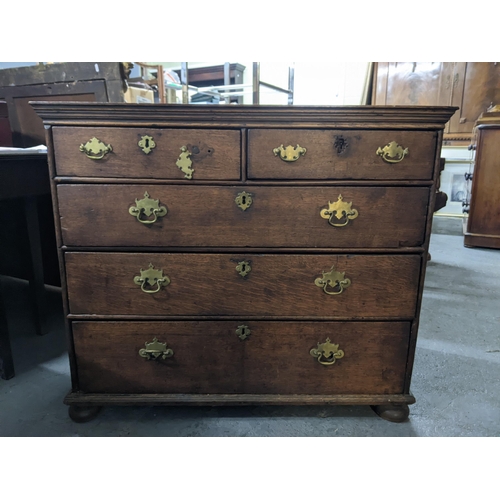 496 - A late 19th/early 20th century oak chest of drawers with two short, three long lockable drawers with... 