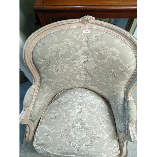 188 - An antique armchair on four turned legs with carved flower motif to top centre Location: G
If there ... 