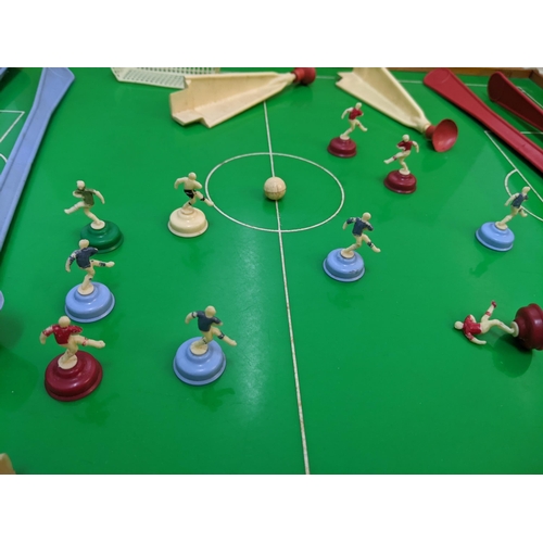 382 - A Super Soccer boardgame consisting of a table  magnetic rods and a quantity of red and blue players... 