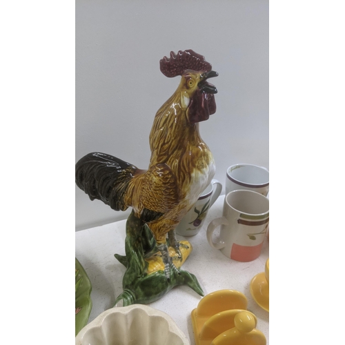 550 - Mixed ceramics and collectables to include 19th century jelly moulds, a 20th century rooster in slip... 