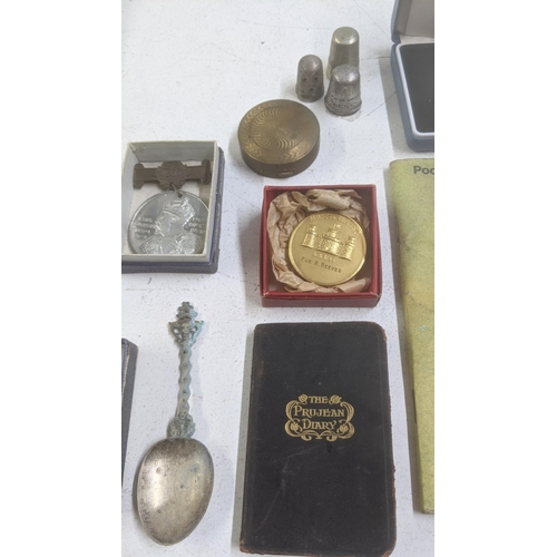 554 - Mixed collectables to include a Victorian Police whistle, two silver thimbles, a silver proof one-po... 