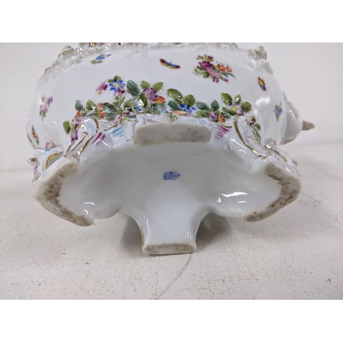 557 - An early 20th century German porcelain centrepiece decorated with a figure and flowers
Location: 6-1... 