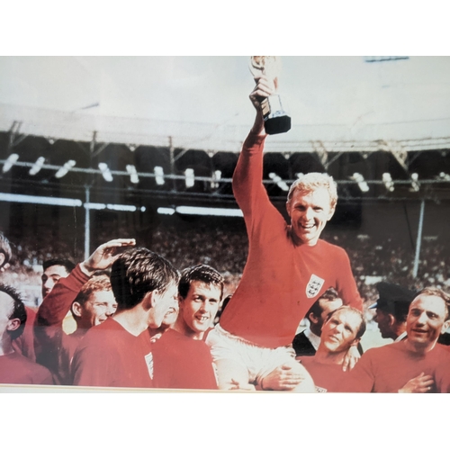 558 - Two England football 1966 World Cup related items to include a World Cup print of a photo, and a Wem... 