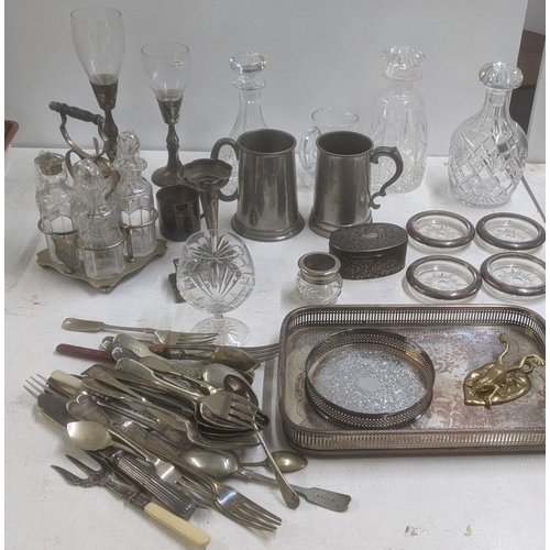 598 - A mixed lot of silver plated items and metalware to include a four-piece cruet set, cutlery and flat... 