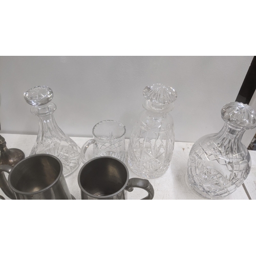 598 - A mixed lot of silver plated items and metalware to include a four-piece cruet set, cutlery and flat... 