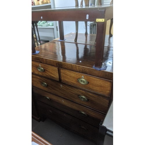 344 - A George III mahogany flat fronted chest of two short and three long graduated drawers, cross banded... 