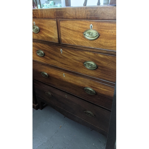 344 - A George III mahogany flat fronted chest of two short and three long graduated drawers, cross banded... 