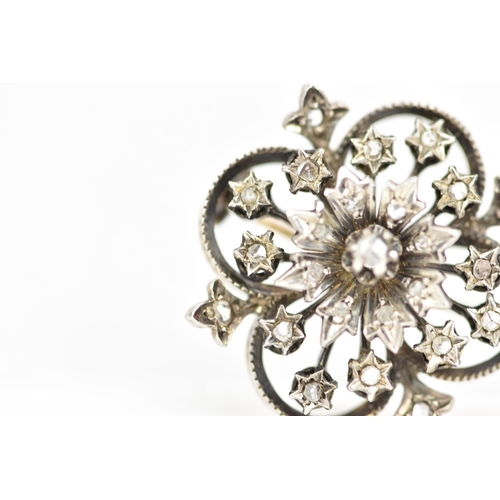 196 - A Victorian gold and white metal diamond floral brooch, the flowerhead en tremblant with central dia... 