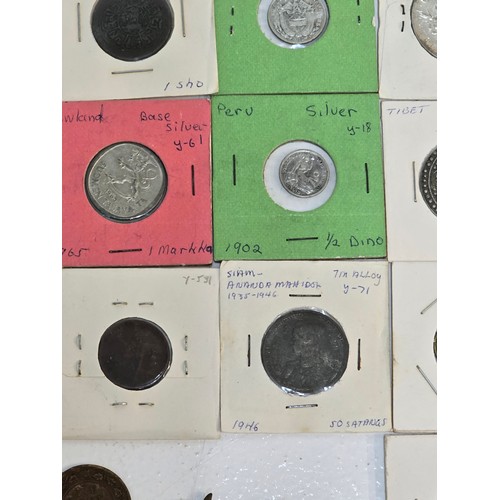 58 - Mixed coins from around the world to include, British India examples George VI Rupee's, Venezuela Si... 