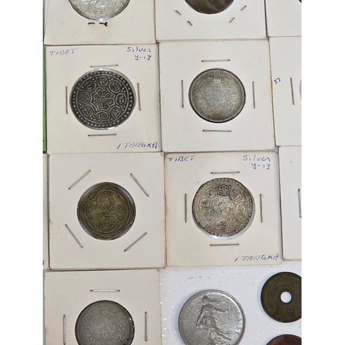 58 - Mixed coins from around the world to include, British India examples George VI Rupee's, Venezuela Si... 