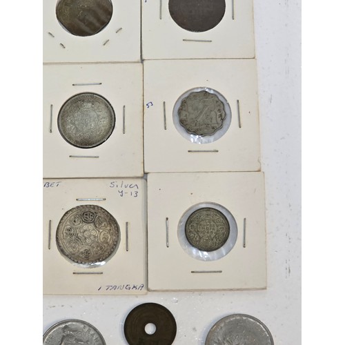 58 - Mixed coins from around the world to include, British India examples George VI Rupee's, Venezuela Si... 