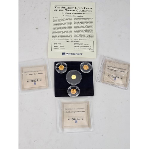 98 - Westminster - 'The Smallest Gold Coins of the World' 24ct Gold 1g Coronation Commemorative, together... 