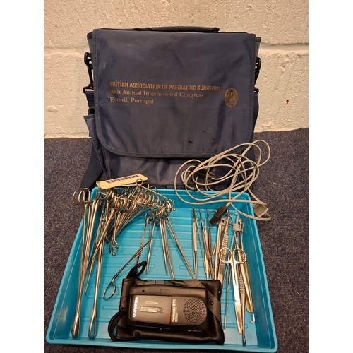 429 - A navy British Association of Paediatric Surgeons bag with contents, mainly scissors and an Olympus ... 