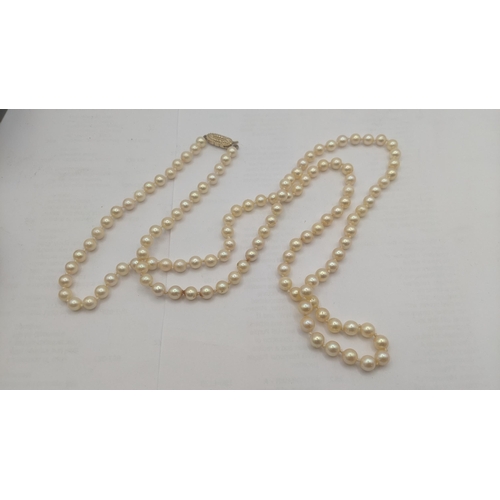 102 - A mixed lot to include a pearl necklace with a 9ct yellow gold clasp together with two white metal p... 