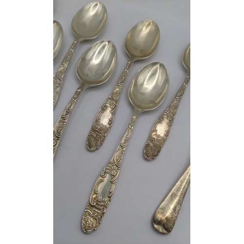 125 - Silver teaspoons to include a set of seven with floral handles hallmarked Sheffield 1906 along with ... 