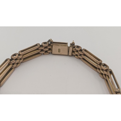 130 - A 9ct rose gold gate link bracelet with later safety chain, total weight 16.9g
Location:CAB6
If ther... 