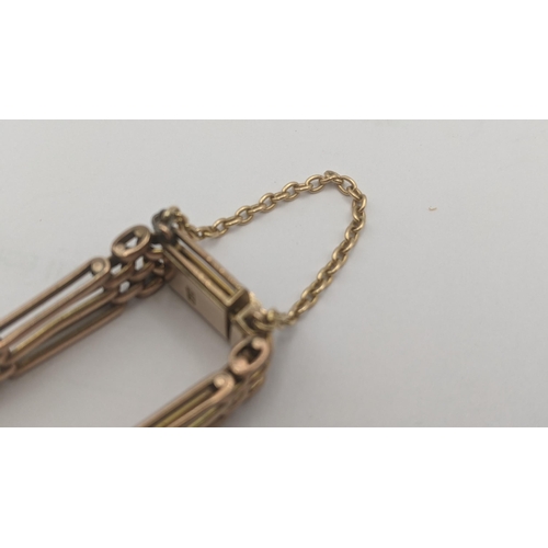 130 - A 9ct rose gold gate link bracelet with later safety chain, total weight 16.9g
Location:CAB6
If ther... 