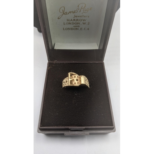 135 - A 9ct yellow gold buckle ring H 1/2 and a 9ct yellow gold necklace, total weight 4.4g
Location:CAB2
... 