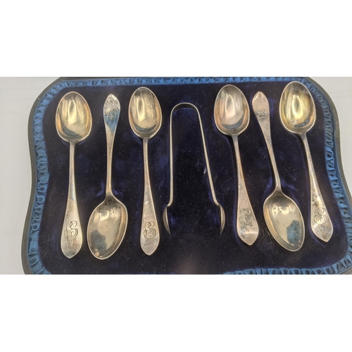 142 - A set of six Victorian silver teaspoons and a pair of sugar tongs having engraved initials to the te... 