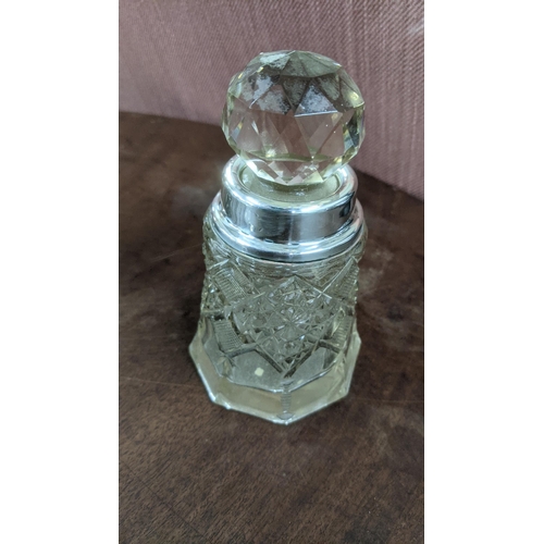 147 - A group of silver and white metal scent bottles to include a Victorian double-ended scent bottle wit... 