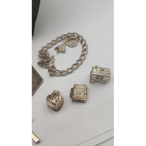 149 - A selection of silver and white metal jewellery to include a flat curb link chain necklace with engr... 