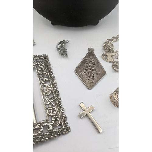 149 - A selection of silver and white metal jewellery to include a flat curb link chain necklace with engr... 