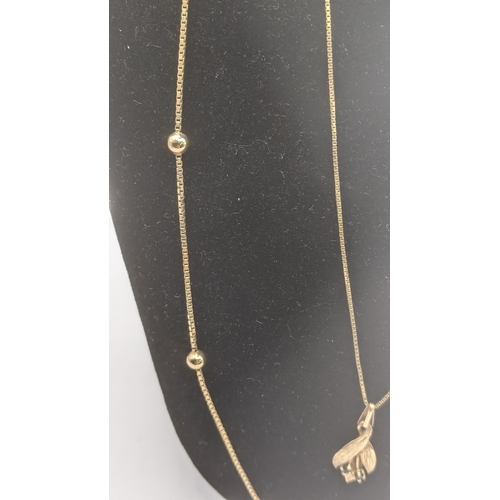 162 - Two ladies 9ct yellow gold necklaces to include an example with a floral pendant set with two sapphi... 