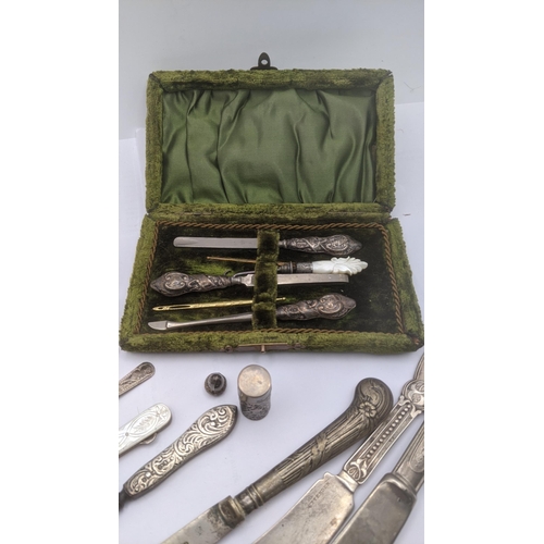 170 - A mixed lot of silver and silver plated items to include Victorian manicure set with silver handles,... 