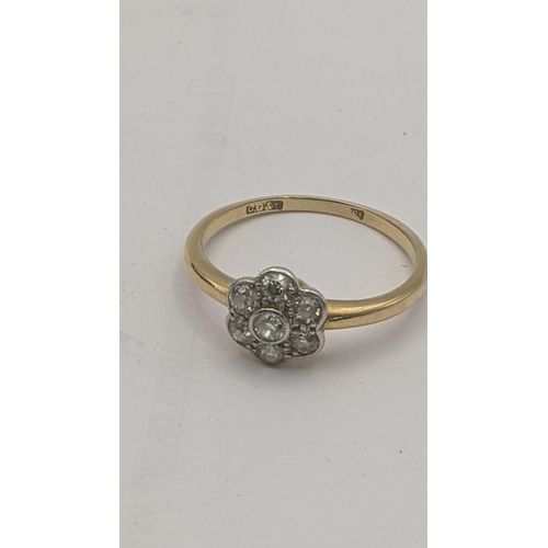 175 - An 18ct yellow gold and seven stone diamond daisy ring, 3g, size Q 1/2
Location:CAB1
If there is no ... 