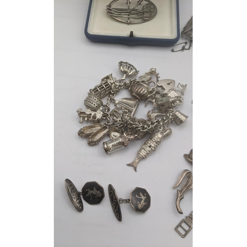 180 - A selection of silver and white metal jewellery and collectables to include a Chinese white metal fi... 