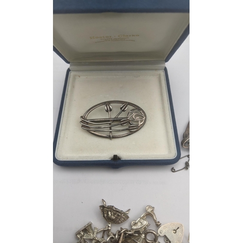 180 - A selection of silver and white metal jewellery and collectables to include a Chinese white metal fi... 