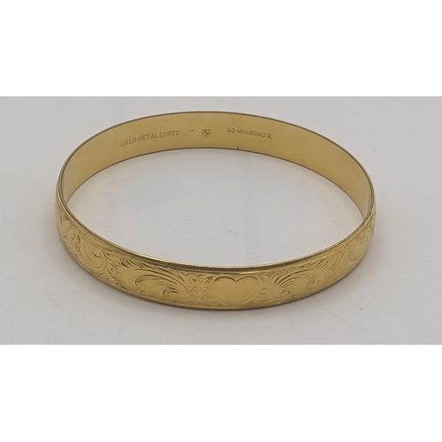 189 - A yellow metal core bangle having floral engraved decoration
Location: C7
If there is no condition r... 