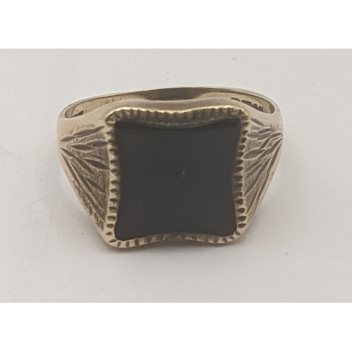 195 - A 9ct yellow gold and black onyx signet ring having engraved decoration to the shoulders
Location: R... 