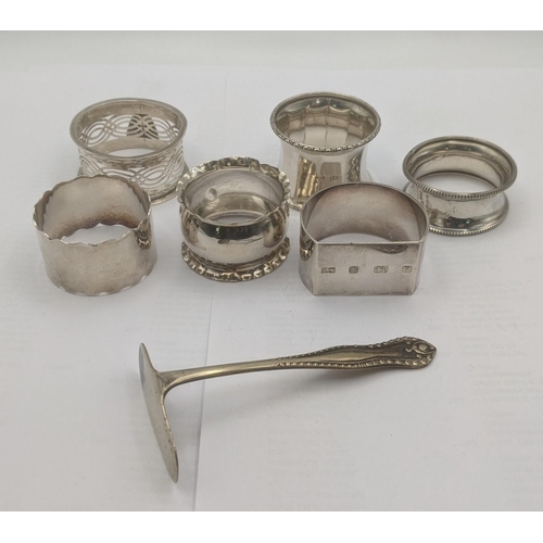 21 - A group of mixed silver napkin rings, one example hallmarked Birmingham 2000 together with a silver ... 