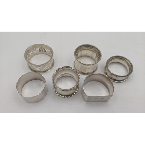 21 - A group of mixed silver napkin rings, one example hallmarked Birmingham 2000 together with a silver ... 