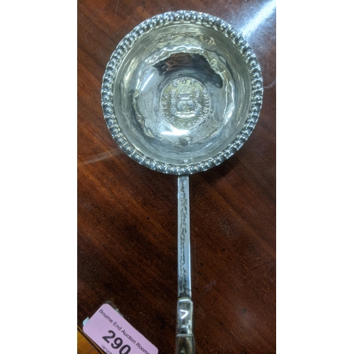 22 - Two white metal toddy ladles set with coins mounted to the bowls
Location:ST
If there is no conditio... 