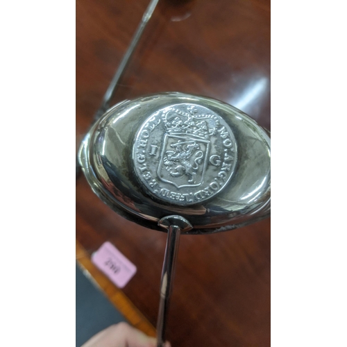 22 - Two white metal toddy ladles set with coins mounted to the bowls
Location:ST
If there is no conditio... 