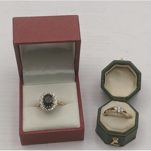 25 - Two 9ct yellow and white gold ladies rings to include an example set with four brilliant cut diamond... 